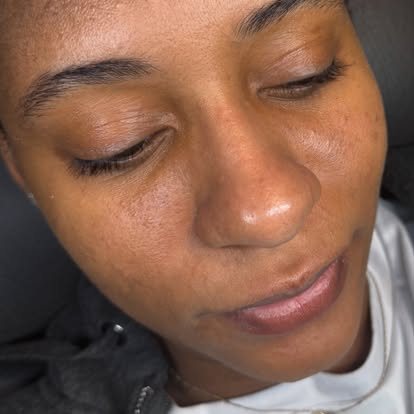 Close-up of groomed brows and radiant skin