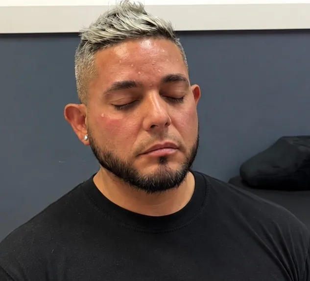 A client relaxing after a gentlemen’s facial